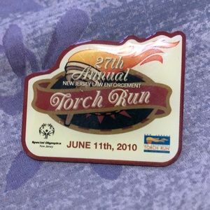 2010 Special Olympics Law Enforcement Torch Run lapel pin. Collect wear or trade